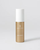 A Danucera Mega Serum bottle with a metallic gold lower body and a white cap, set against a clean light gray background.