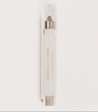 Load image into Gallery viewer, White skincare product with silver cap on a light gray background
